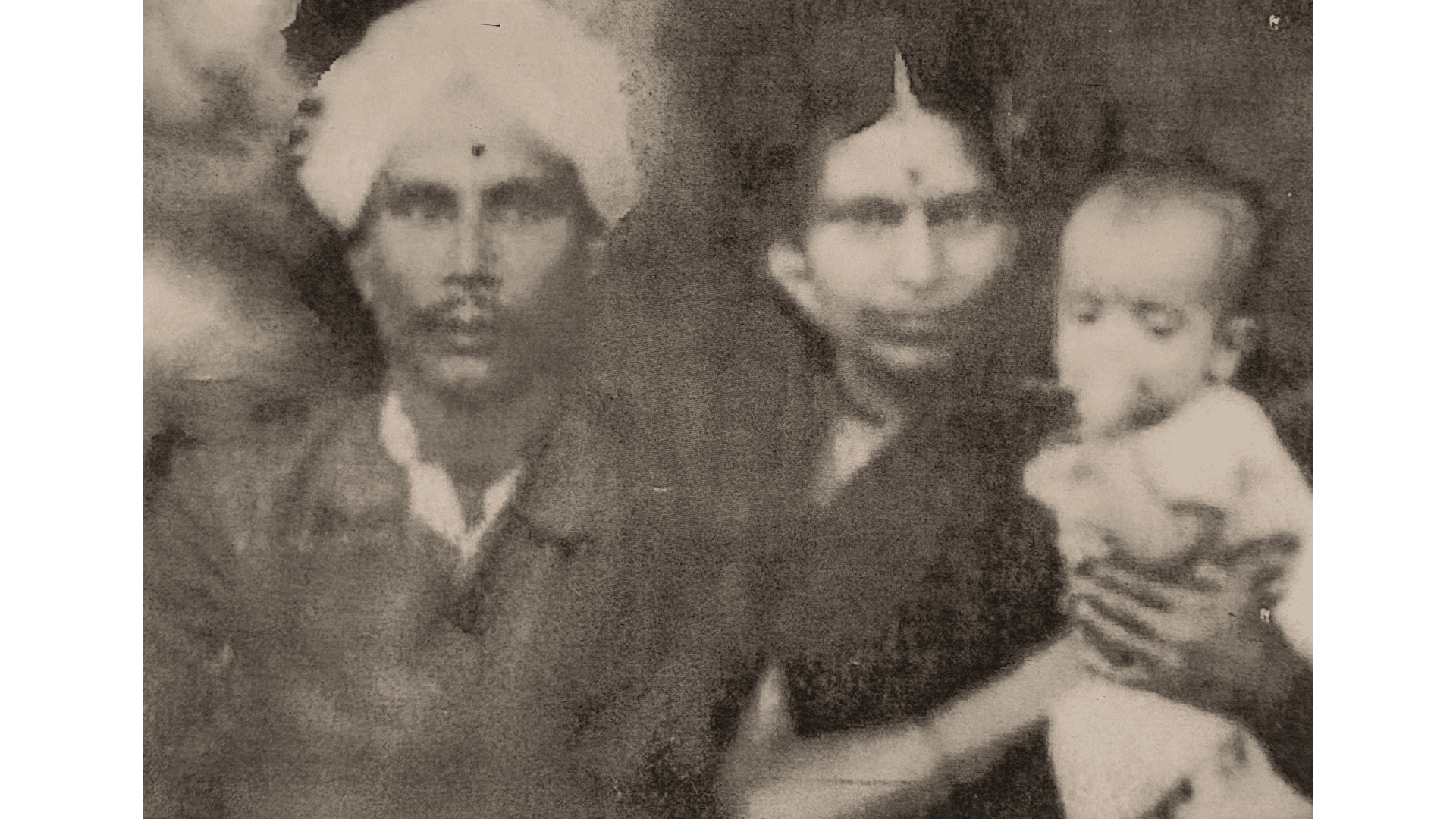 Archival photograph — In infancy, with his parents