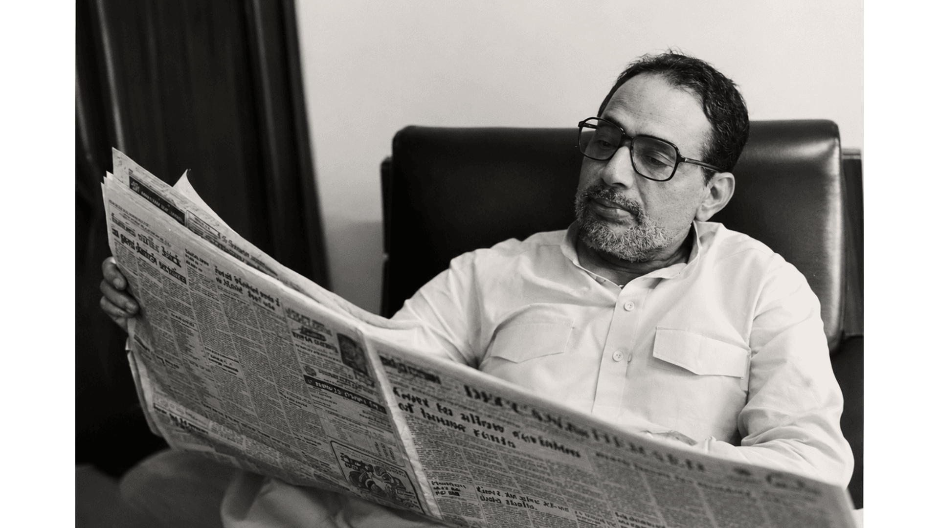 Archival photograph — Reading the morning papers