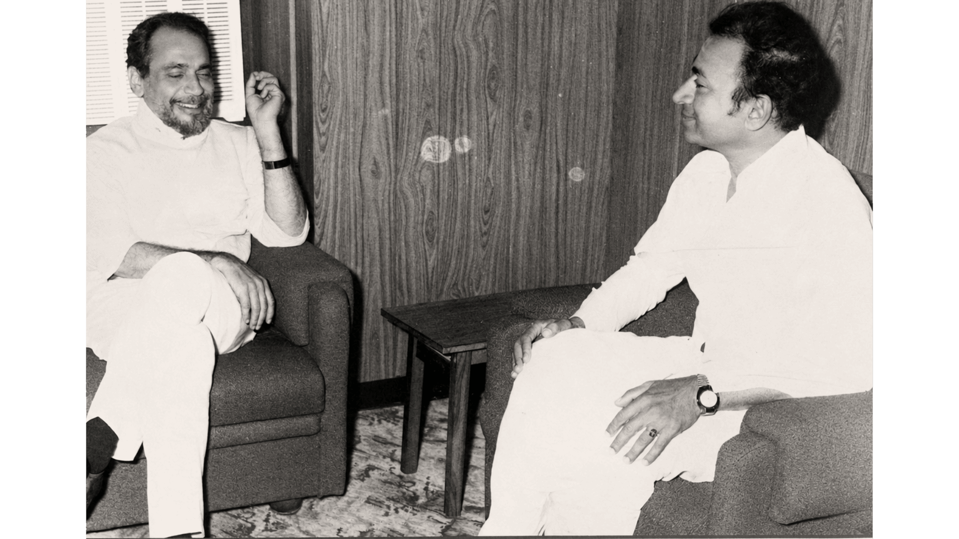 Archival photograph — In conversation with a colleague
