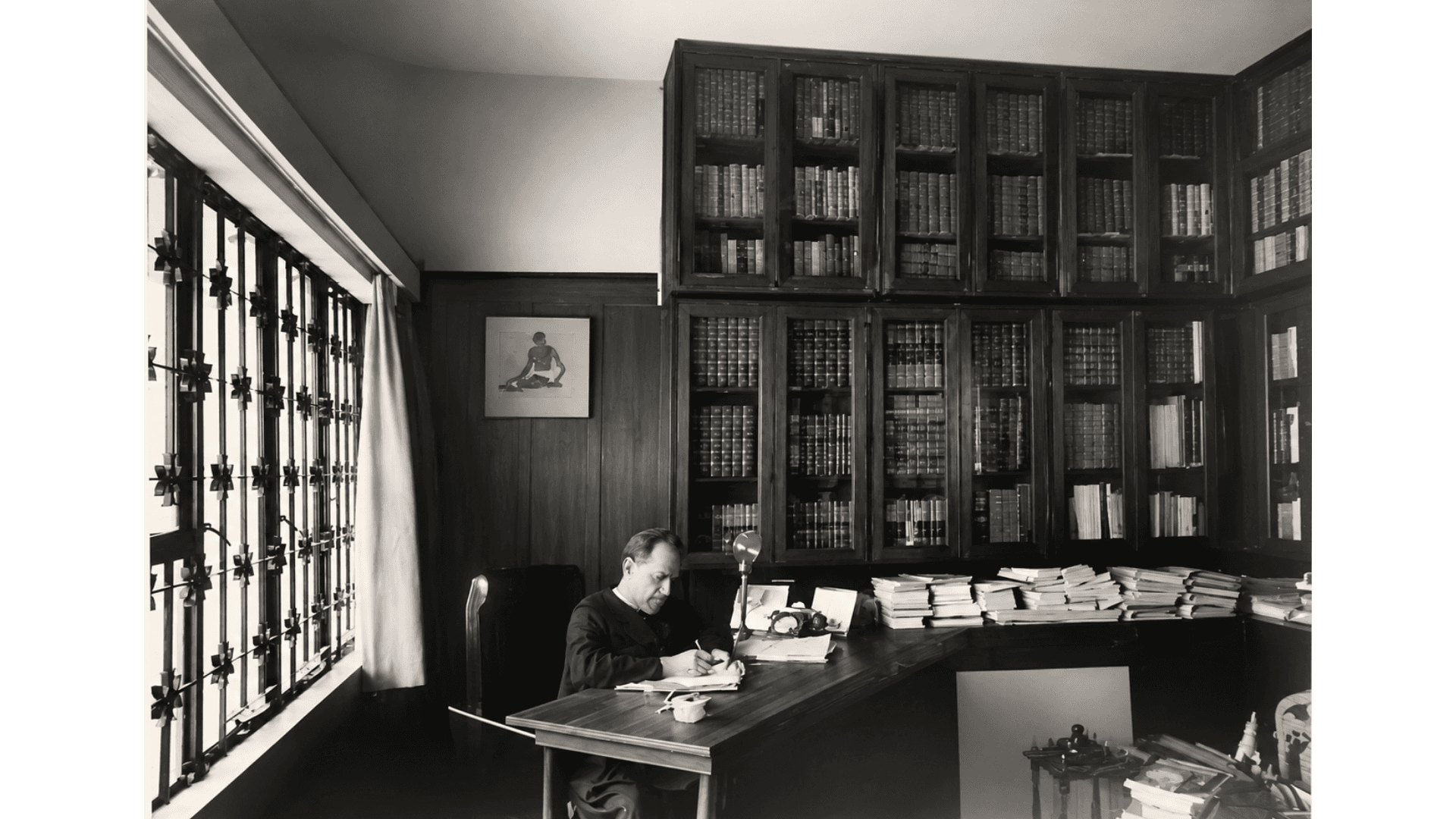 Archival photograph — At work in his personal library
