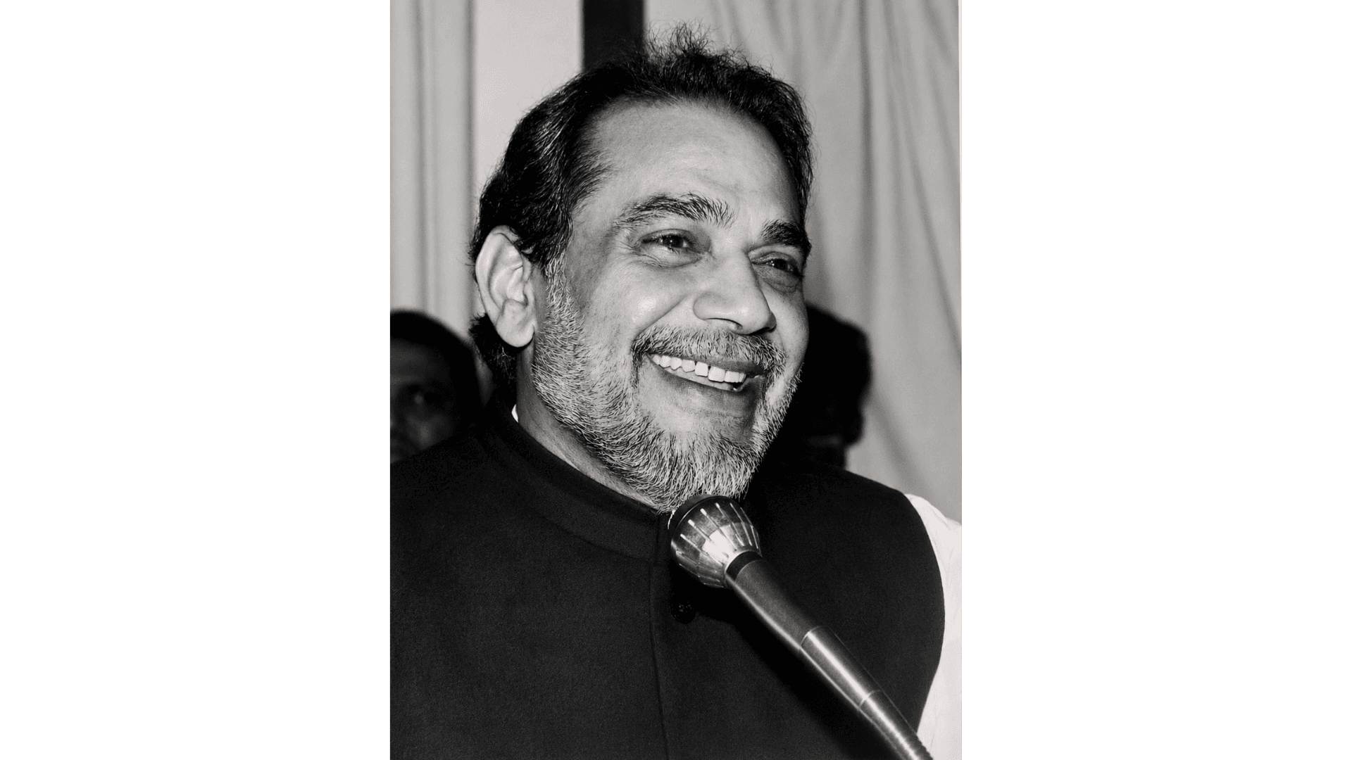 Archival photograph — Mid-address, at the microphone